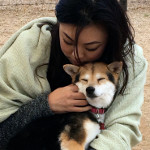 Volunteer Wendy embracing Maggie the dog