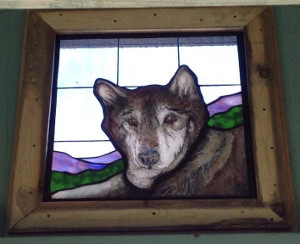 Stained glass image of Molly Bear in the Healing Heart Chapel