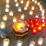 Candles lit at a healing ceremony for those who have lost an animal